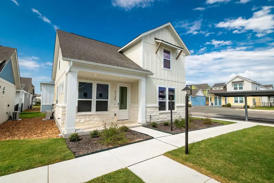 Modern vertical siding and stone accents create striking curb appeal for this two-story home. Modern vertical siding and stone accents create striking curb appeal for this two-story home.