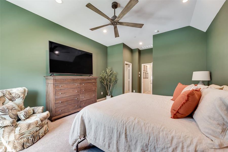 Bedroom featuring carpet flooring, a ceiling fan, vaulted ceiling, and recessed lighting
