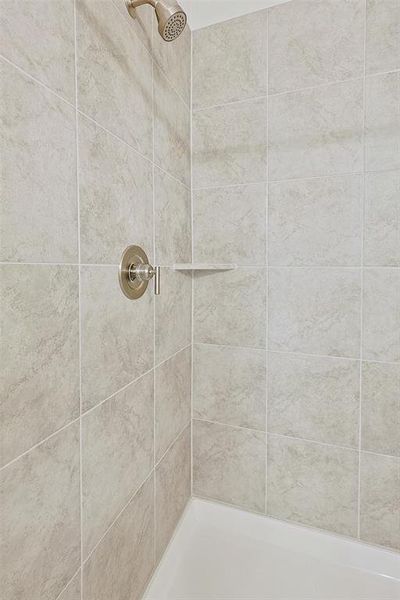 Bathroom featuring tiled shower