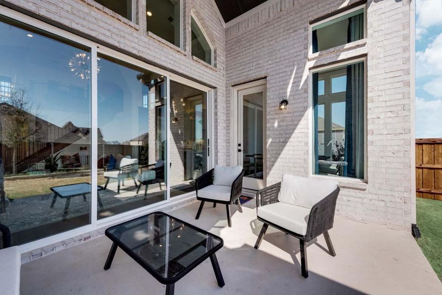 Exterior details and patio area of a home in Justin Crossing, Justin (Image 21).