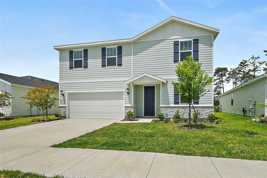 Front exterior of a new home in , Palm Coast, FL, highlighting curb appeal (Image 27). Front exterior of a new home in , Palm Coast, FL, highlighting curb appeal (Image 27).