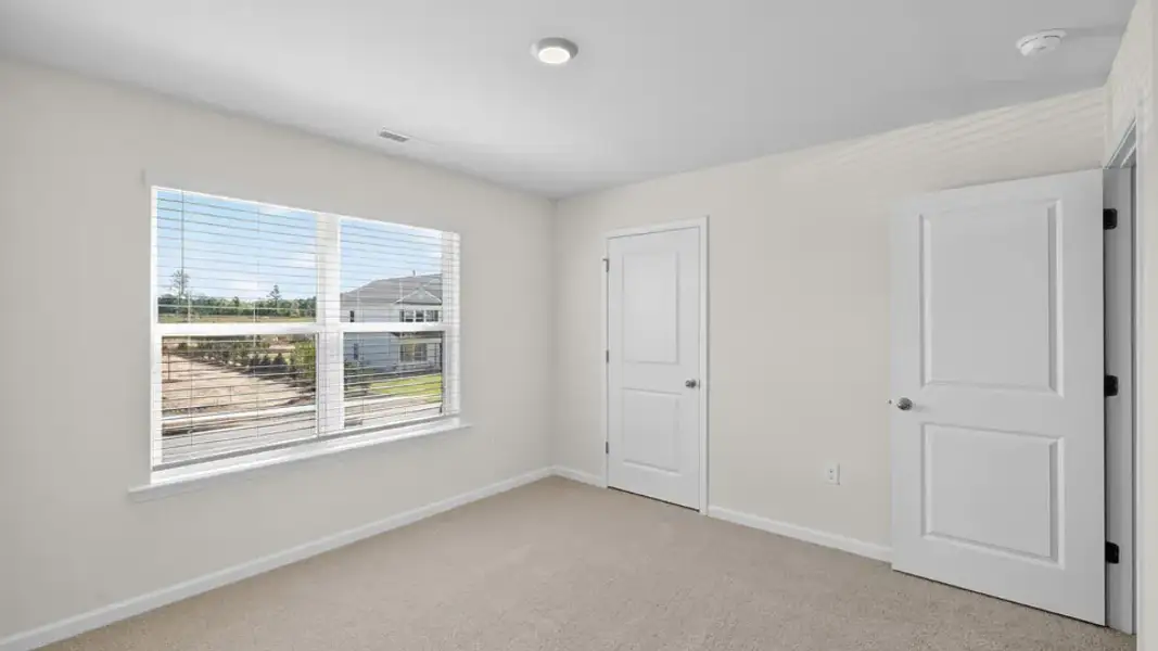 Spacious, unfurnished interior of a new home in Mangum Farms, Stem (Image 24).
