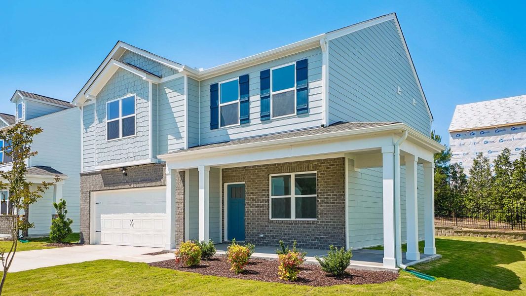 Front exterior of a new home in Anderson Farm, Wendell, NC, highlighting curb appeal (Image 13). Front exterior of a new home in Anderson Farm, Wendell, NC, highlighting curb appeal (Image 13).