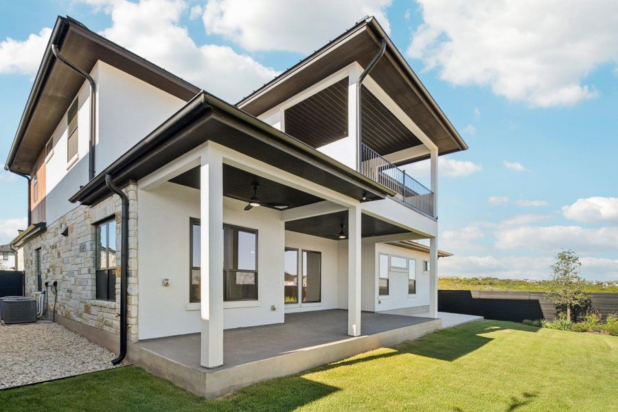 Exterior details and patio area of a home in Milky Way at River Place, Austin (Image 3).