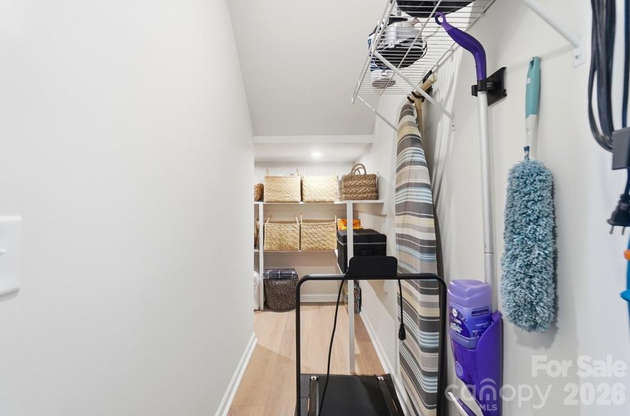 Custom shelving in under stairway closet!