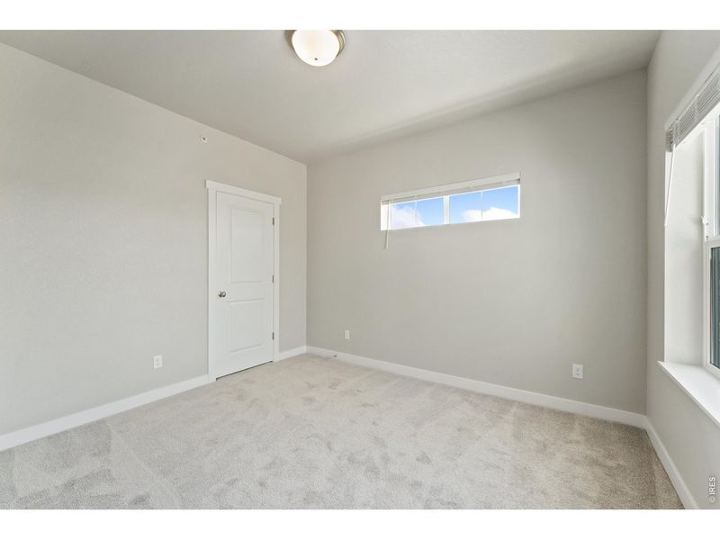 Spacious, unfurnished interior of a new home in The Lakes at Centerra, Loveland (Image 36).
