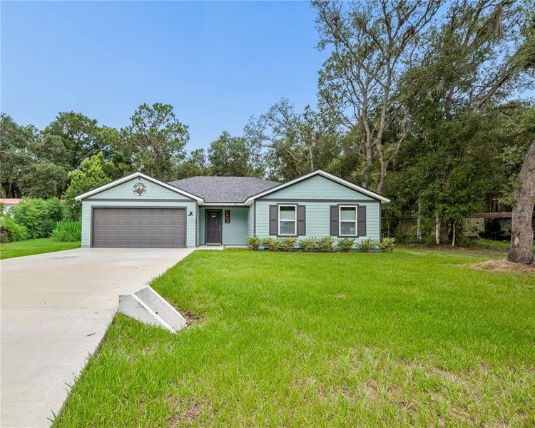 Front exterior of a new home in , Satsuma, FL, highlighting curb appeal (Image 2). Front exterior of a new home in , Satsuma, FL, highlighting curb appeal (Image 2).