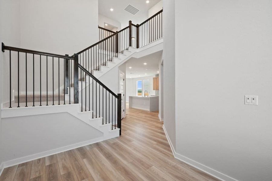 Spacious, unfurnished interior of a new home in Terrace Collection At Turner's Crossing, Buda (Image 23).