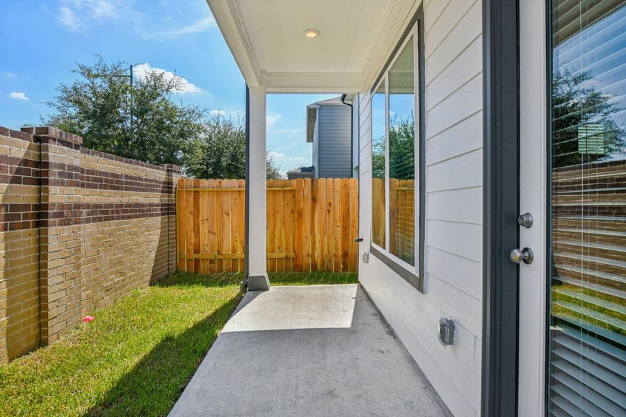 Exterior details and patio area of a home in Spring Brook Village - Luxe Series, Houston (Image 2).