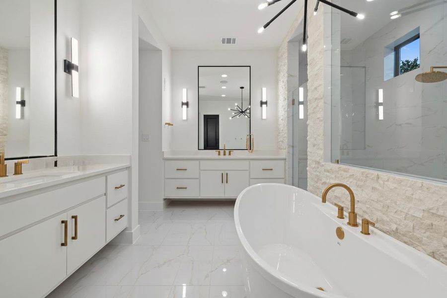 Freestanding soaking tub with brass fixtures