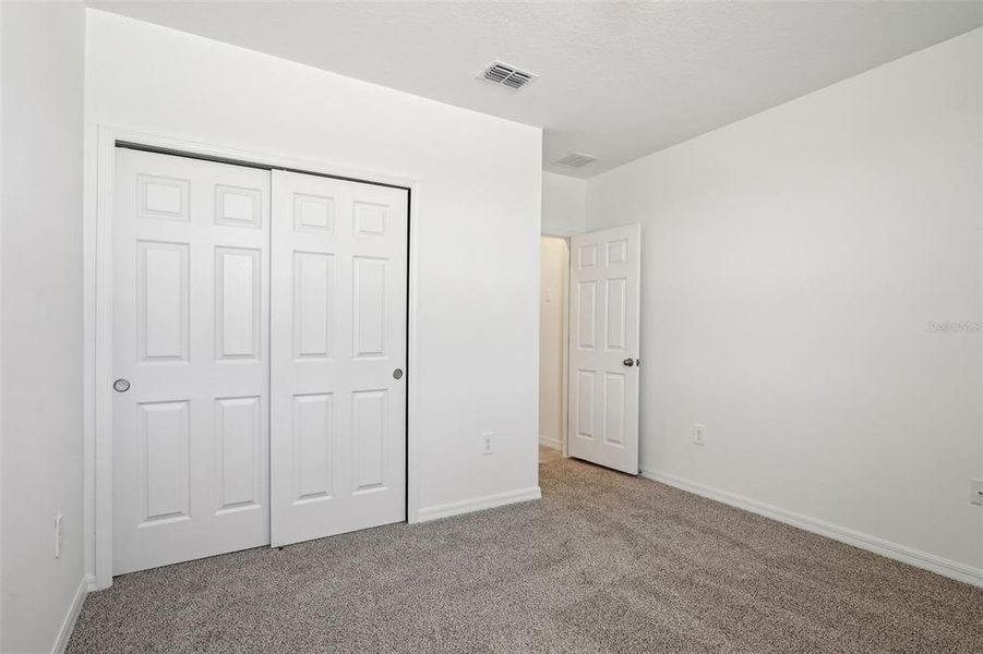 Spacious, unfurnished interior of a new home in Lake Deer Estates - Signature Series, Poinciana (Image 37). Spacious, unfurnished interior of a new home in Lake Deer Estates - Signature Series, Poinciana (Image 37).