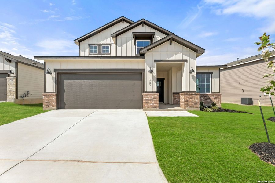 Front exterior of a new home in Veranda Signature, San Antonio, TX, highlighting curb appeal (Image 2). Front exterior of a new home in Veranda Signature, San Antonio, TX, highlighting curb appeal (Image 2).