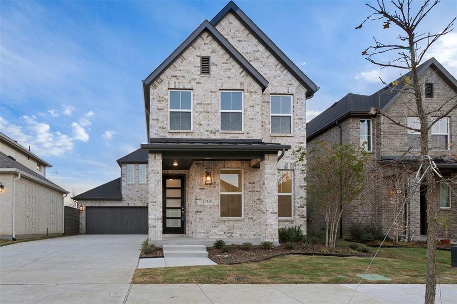 View of front of property with a garage