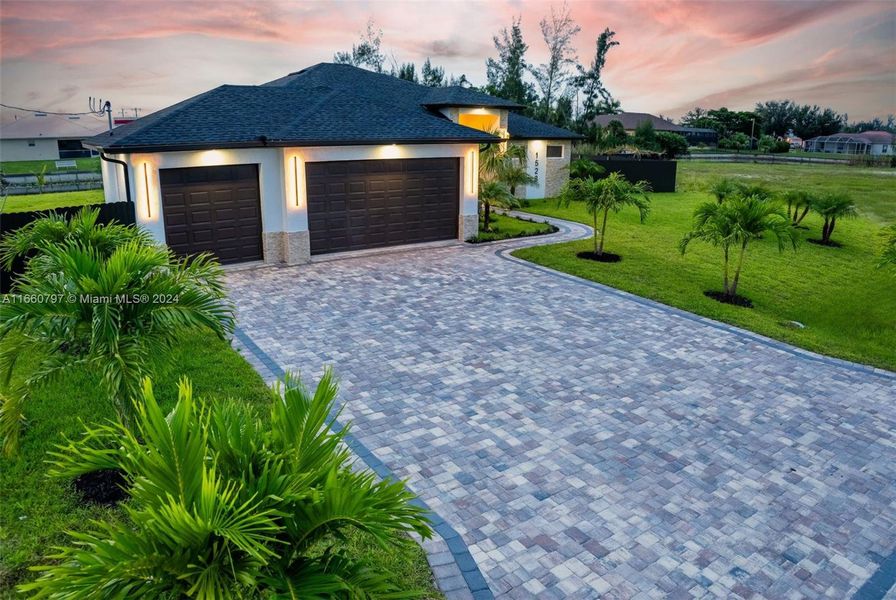 Front exterior of a new home in , Cape Coral, FL, highlighting curb appeal (Image 1).