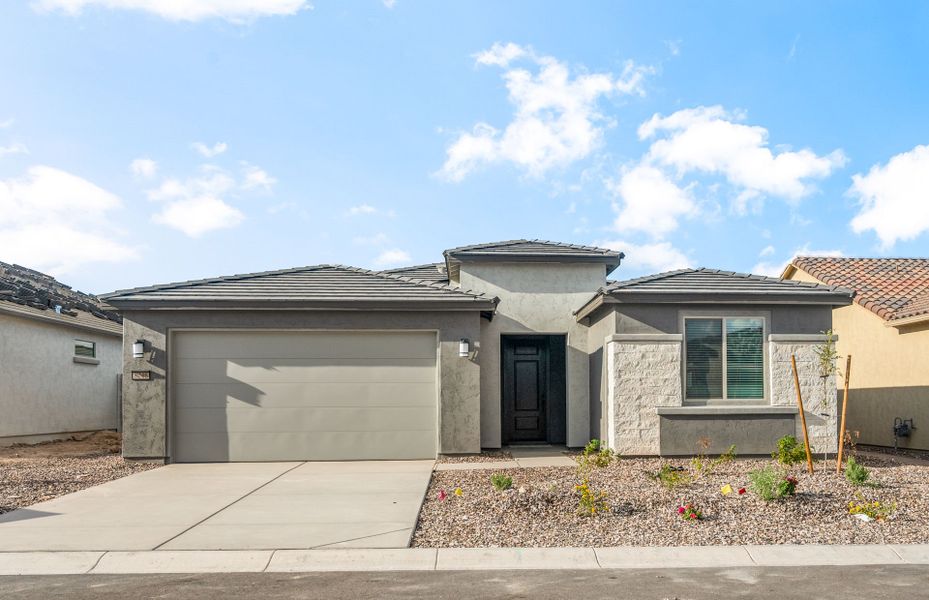 Front exterior of a new home in Sun City Anthem at Merrill Ranch, Florence, AZ, highlighting curb appeal (Image 2).