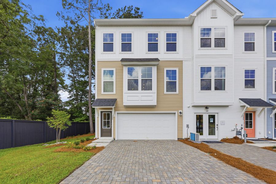 Front exterior of a new home in Rhetts Cove, Johns Island, SC, highlighting curb appeal (Image 2). Front exterior of a new home in Rhetts Cove, Johns Island, SC, highlighting curb appeal (Image 2).