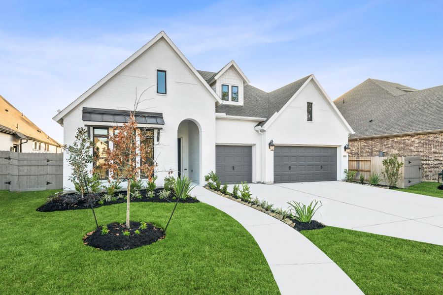 Front exterior of a new home in ARTAVIA - Parkview Collection, Conroe, TX, highlighting curb appeal (Image 26). Front exterior of a new home in ARTAVIA - Parkview Collection, Conroe, TX, highlighting curb appeal (Image 26).