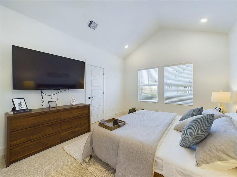 The elegant primary bedroom is located on the second floor. It features high ceilings recessed lighting, prewired and blocked for ceiling fans (not included). Please note that the photos are from another development by Disama Group, finishes and colors may vary.