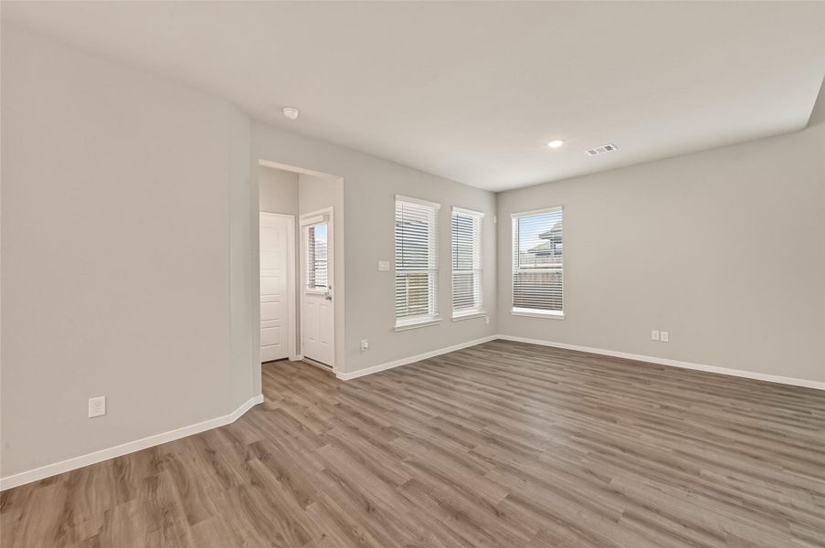 Spacious, unfurnished interior of a new home in Sunterra, Katy (Image 32).