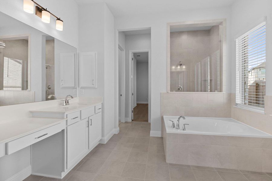 Primary Bath retreat with dual vanities, garden tub & walk-in shower Primary Bath retreat with dual vanities, garden tub & walk-in shower