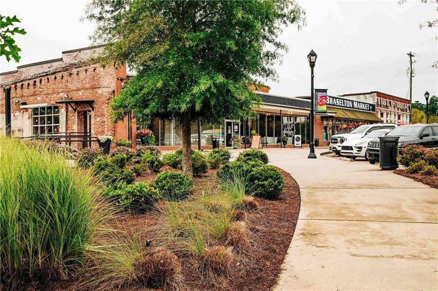 Front exterior of a new home in Rosewood Lake Estates, Hoschton, GA, highlighting curb appeal (Image 33).