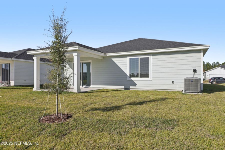 Exterior details and patio area of a home in Cypress Meadows - Signature Series, Jacksonville (Image 4).
