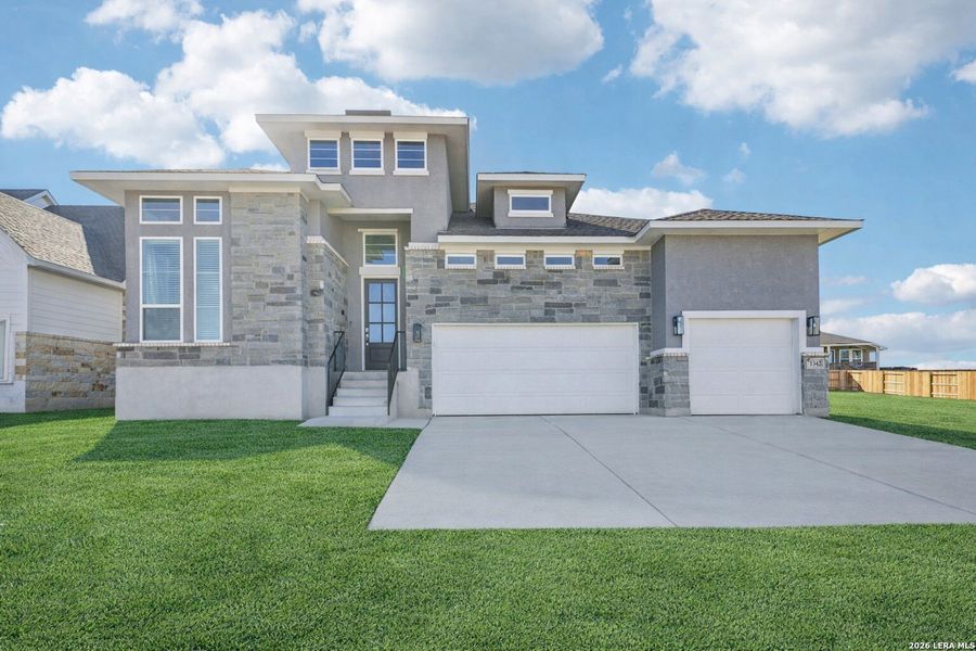 Front exterior of a new home in Meyer Ranch, New Braunfels, TX, highlighting curb appeal (Image 2).