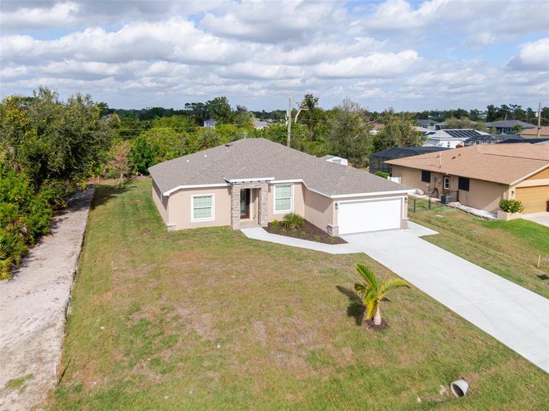 Front exterior of a new home in , Englewood, FL, highlighting curb appeal (Image 1). Front exterior of a new home in , Englewood, FL, highlighting curb appeal (Image 1).