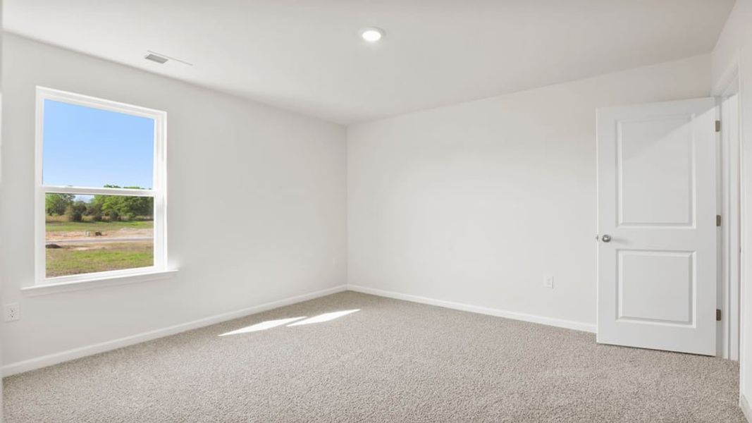 Spacious, unfurnished interior of a new home in Durbin Meadows Traditions, Fountain Inn (Image 26).