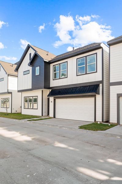 Front exterior of a new home in Metro Village, Houston, TX, highlighting curb appeal (Image 26). Front exterior of a new home in Metro Village, Houston, TX, highlighting curb appeal (Image 26).