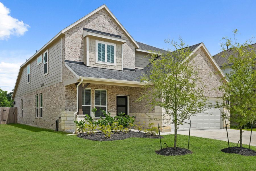Front exterior of a new home in Grand Oaks – The Cove, Houston, TX, highlighting curb appeal (Image 17). Front exterior of a new home in Grand Oaks – The Cove, Houston, TX, highlighting curb appeal (Image 17).