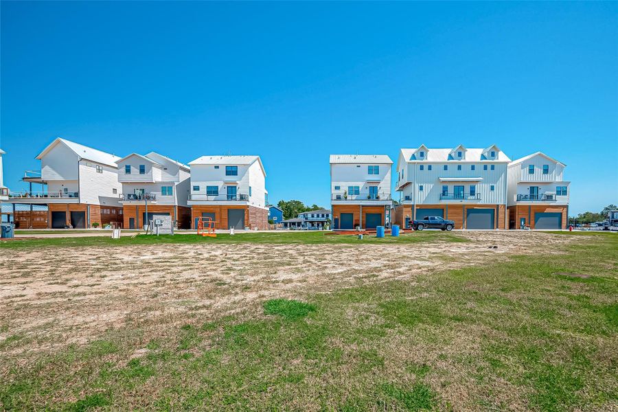 Front exterior of a new home in , Taylor Lake Village, TX, highlighting curb appeal (Image 8).