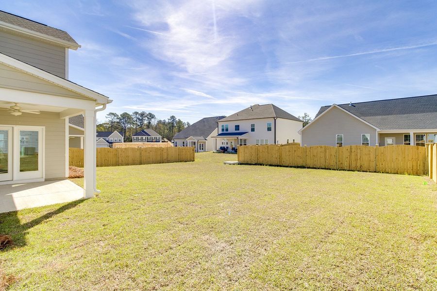 Exterior details and patio area of a home in Pebble Branch, Chapin (Image 4).