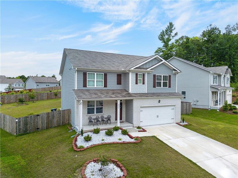 Front exterior of a new home in Glen at Kensington, Lithia Springs, GA, highlighting curb appeal (Image 21).