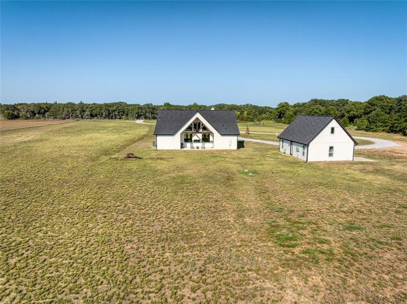 Front exterior of a new home in , Bowie, TX, highlighting curb appeal (Image 23).