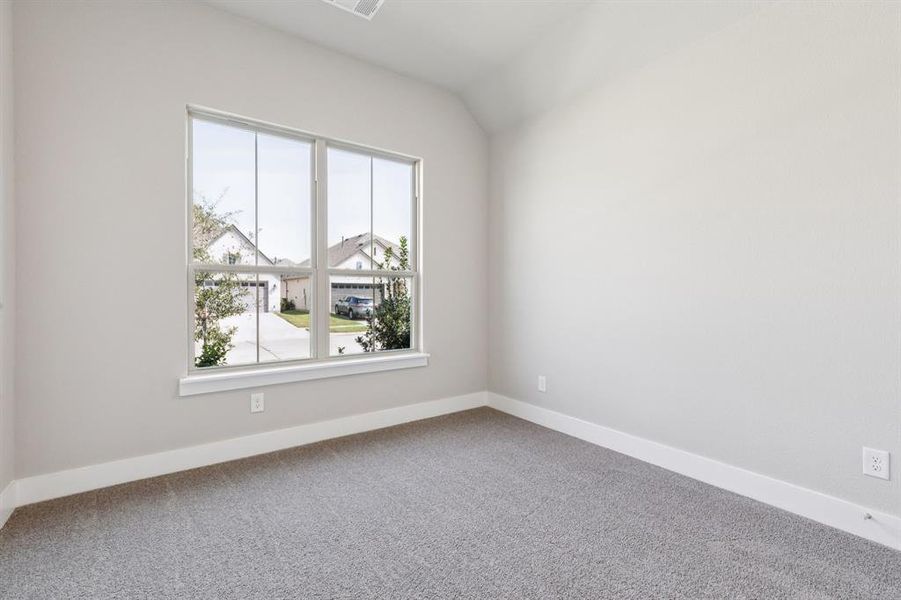 Carpeted empty room with baseboards