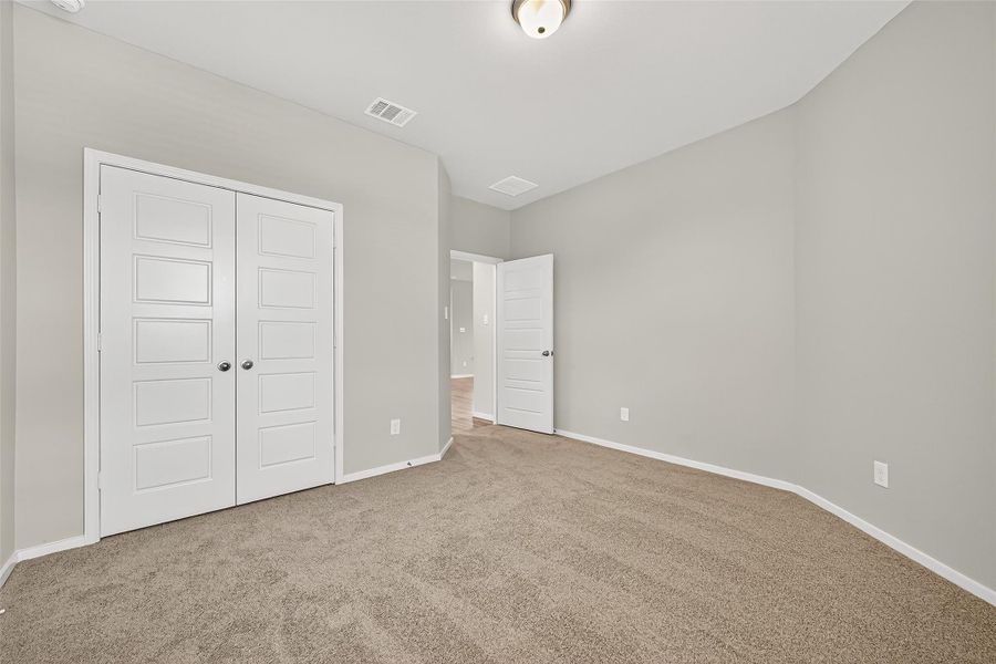 Spacious, unfurnished interior of a new home in Sunterra, Katy (Image 28).