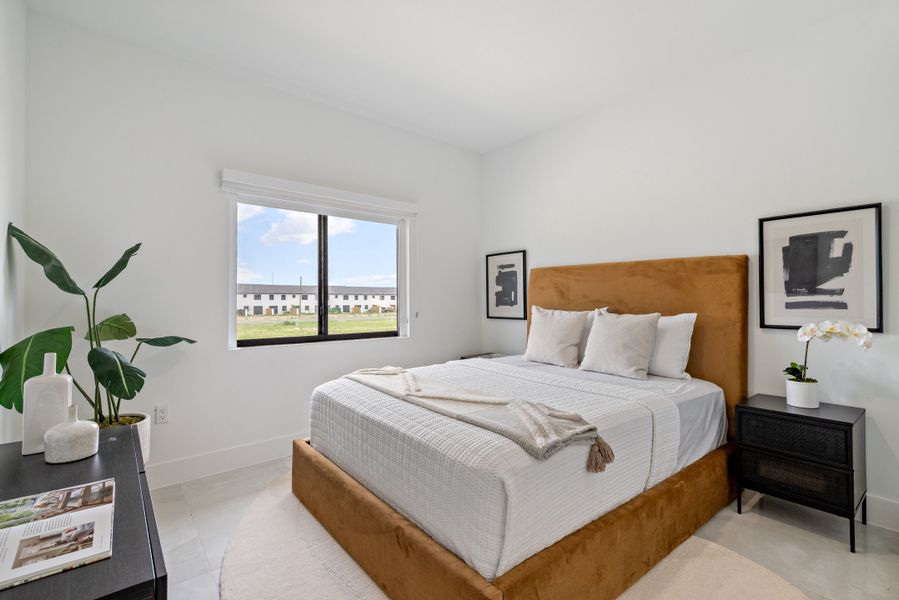 Representative furnished interior of a home built from the Model E by Onx Homes in On Alba, Florida City (Image 42).