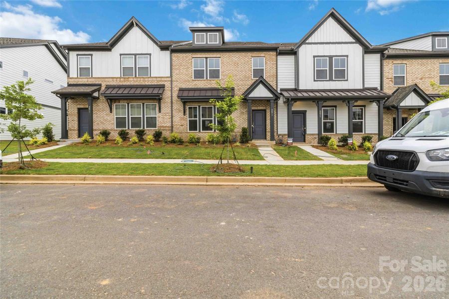 Front exterior of a new home in Ridge at Sugar Creek, Indian Land, SC, highlighting curb appeal (Image 2). Front exterior of a new home in Ridge at Sugar Creek, Indian Land, SC, highlighting curb appeal (Image 2).