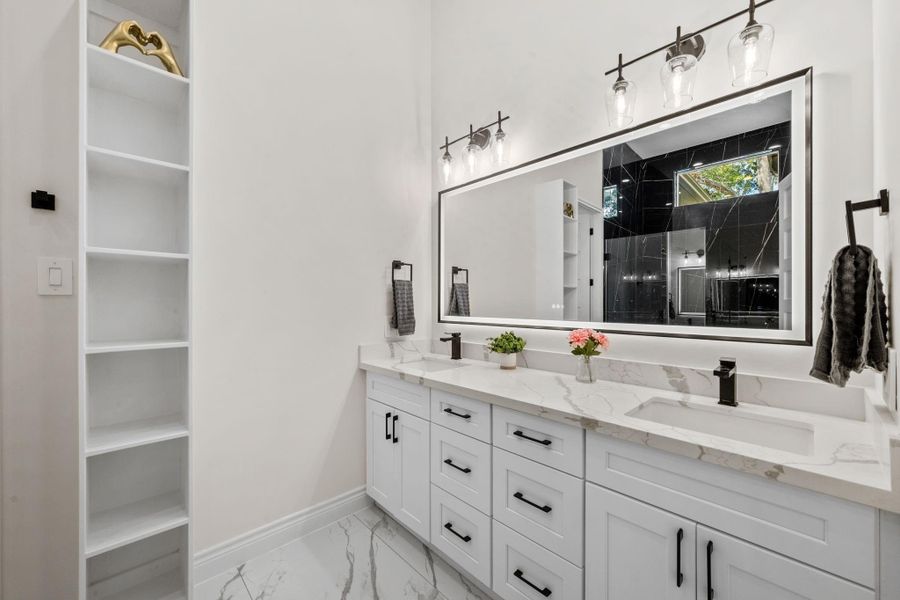 Restroom with a double vanity that the 3rd and 4th bedroom can share if they choose.