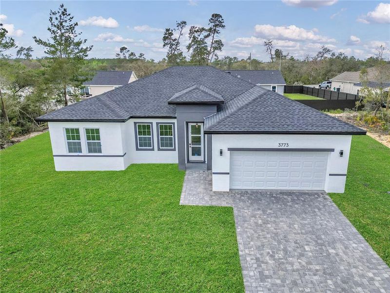 Front exterior of a new home in , Ocala, FL, highlighting curb appeal (Image 26).