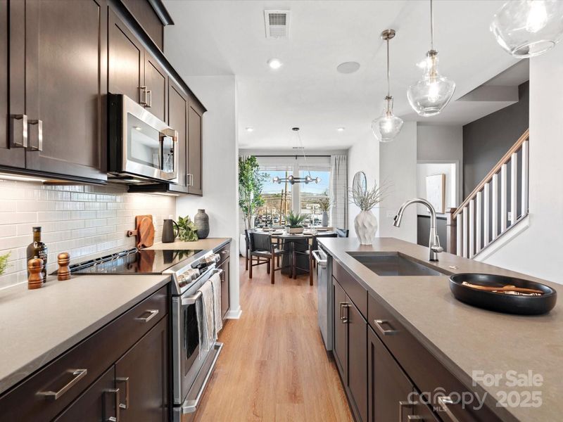Quartz Countertops Paired with Designer Selected Backsplash.