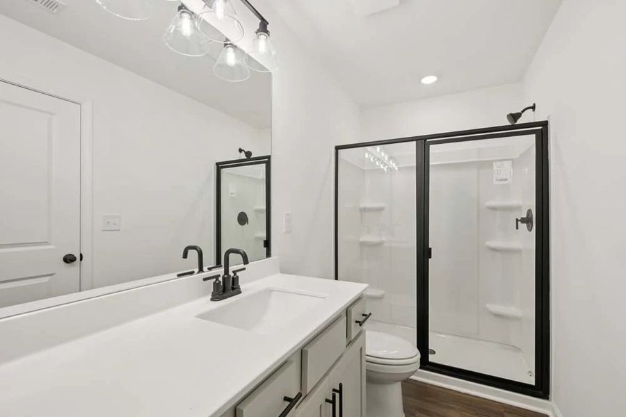 Primary Bathroom featuring Artisan Collection Finishes Walk-In Shower