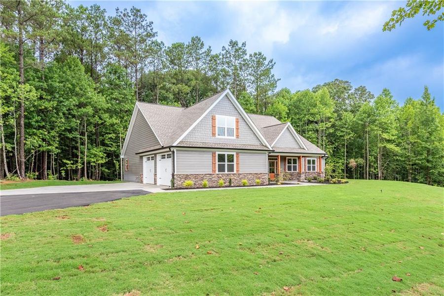 Front exterior of a new home in , Jasper, GA, highlighting curb appeal (Image 29). Front exterior of a new home in , Jasper, GA, highlighting curb appeal (Image 29).