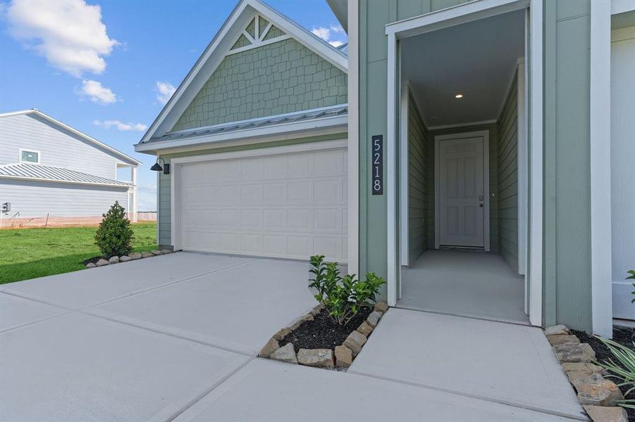 Front exterior of a new home in Grand Cay Harbour, Texas City, TX, highlighting curb appeal (Image 19). Front exterior of a new home in Grand Cay Harbour, Texas City, TX, highlighting curb appeal (Image 19).