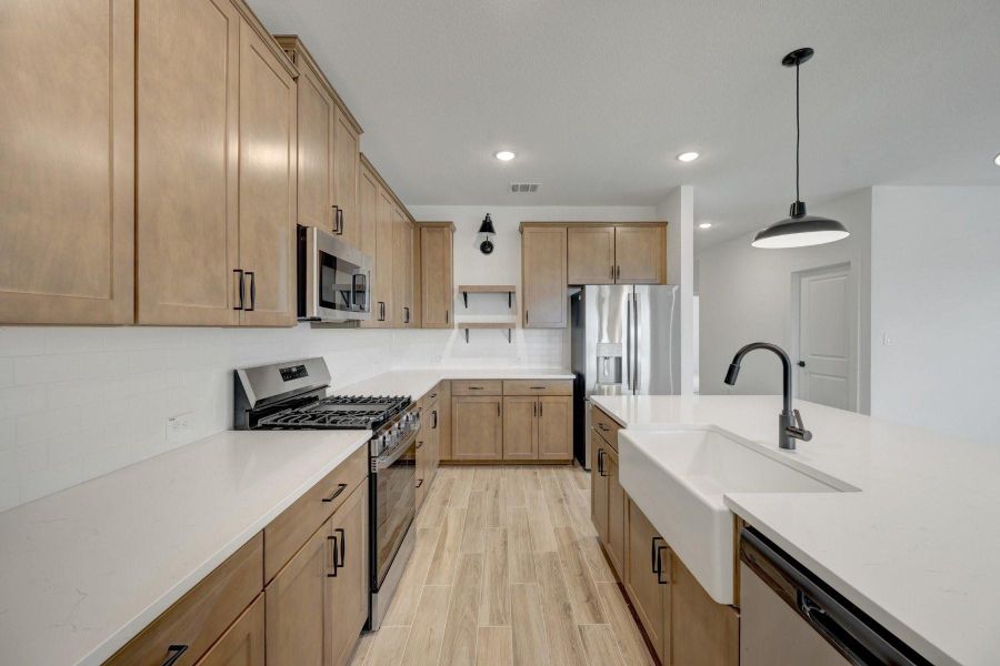 Stylish kitchen with chestnut brown cabinets Stylish kitchen with chestnut brown cabinets
