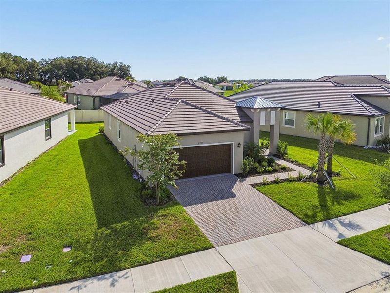 Front exterior of a new home in Mirada Active Adult, San Antonio, FL, highlighting curb appeal (Image 23).