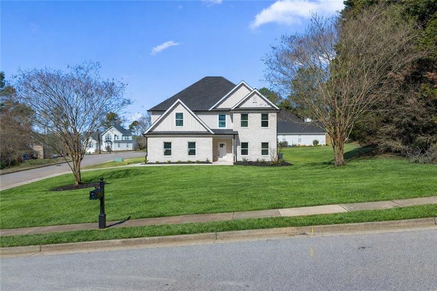 Front exterior of a new home in , Stockbridge, GA, highlighting curb appeal (Image 29). Front exterior of a new home in , Stockbridge, GA, highlighting curb appeal (Image 29).