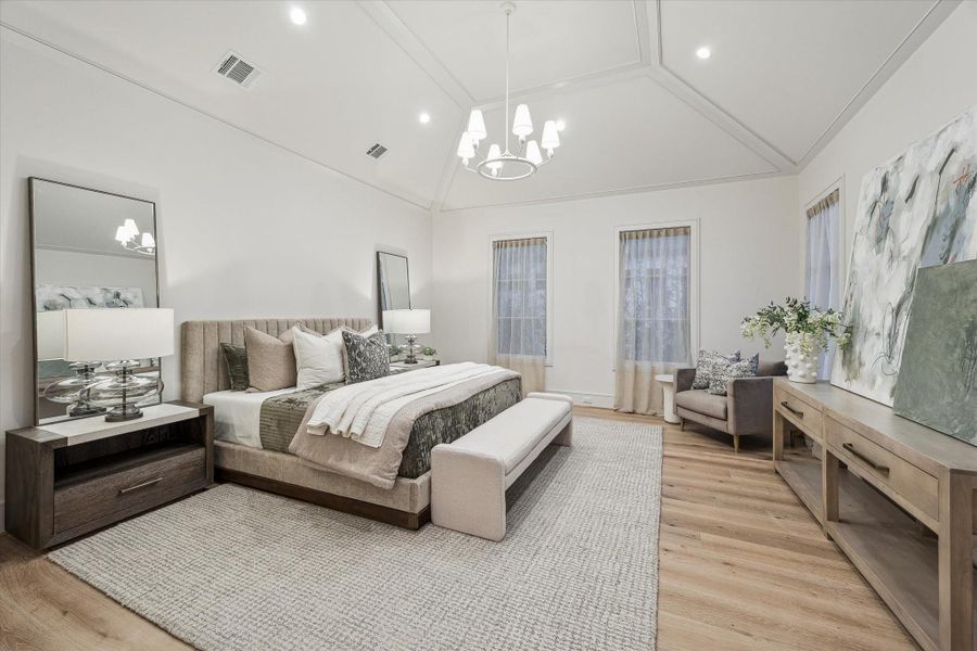 The primary bedroom is fit for royalty. Vaulted, 12-foot ceilings expand the space and multiple windows bring in natural light. A king bed and supplemental furniture will fit with ease.