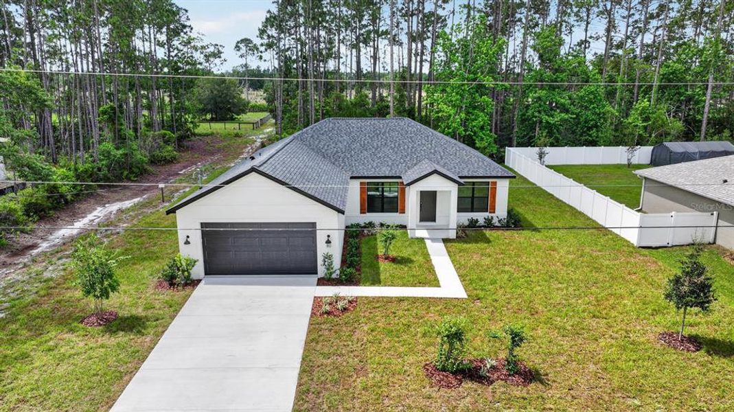 Front exterior of a new home in , Palm Coast, FL, highlighting curb appeal (Image 27). Front exterior of a new home in , Palm Coast, FL, highlighting curb appeal (Image 27).